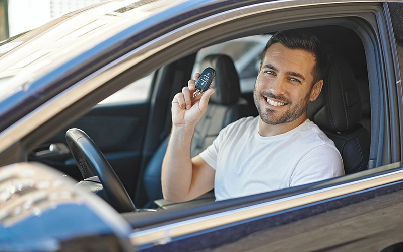 man in new car